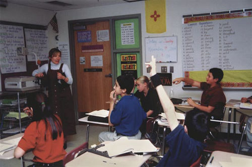 Photo of Bernalillo literacy coach Jody Marinucci models a lesson for one of the middle school teachers.