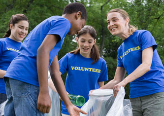Teenage volunteers cleaning up a park