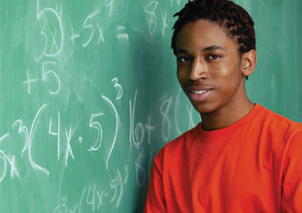 Boy in front of a chalkboard