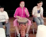 girl playing on a drum