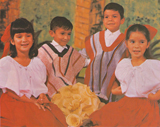 Children dancing to a song from Paso a Paso con los Niños