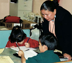 Photo of KEWA CCLC program director JoAnn Melchor enjoys helping students with their homework.