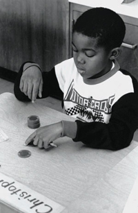 Child performing a counting exercise.