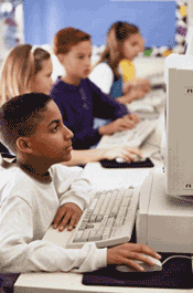 Picture of students using computers in a classroom.